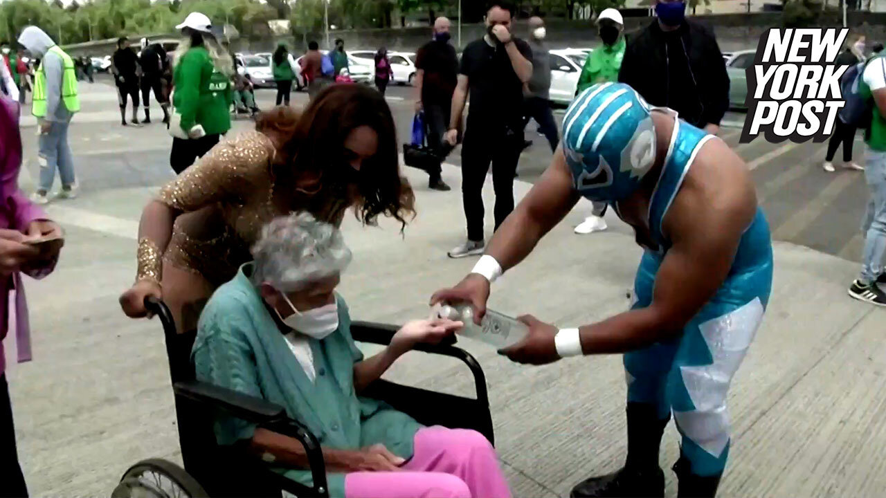 Mexican wrestlers help elderly get COVID-19 vaccines