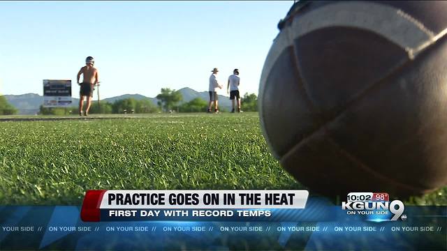 Intense heat doesn't stop high school football practice