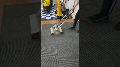 Learning dry extraction skills during carpet care class at the Academy