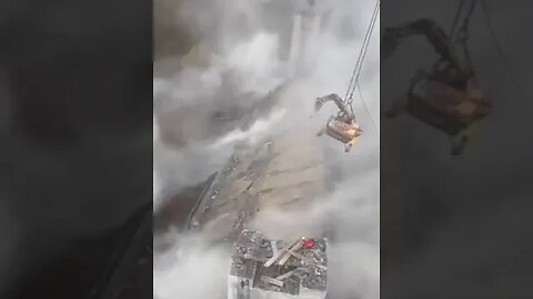 Crane Destroying bridge hanging from ropes