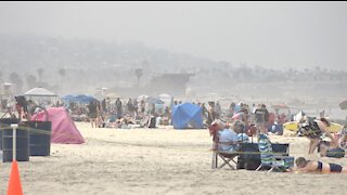 Visitors fill San Diego beaches as heat wave hits the Pacific Southwest