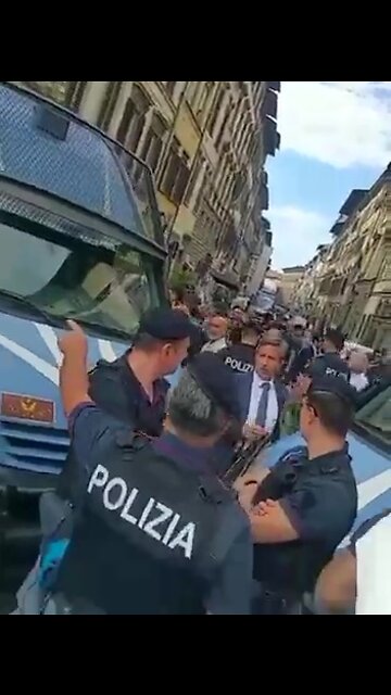 Italy - People surround the police and call them murderers.