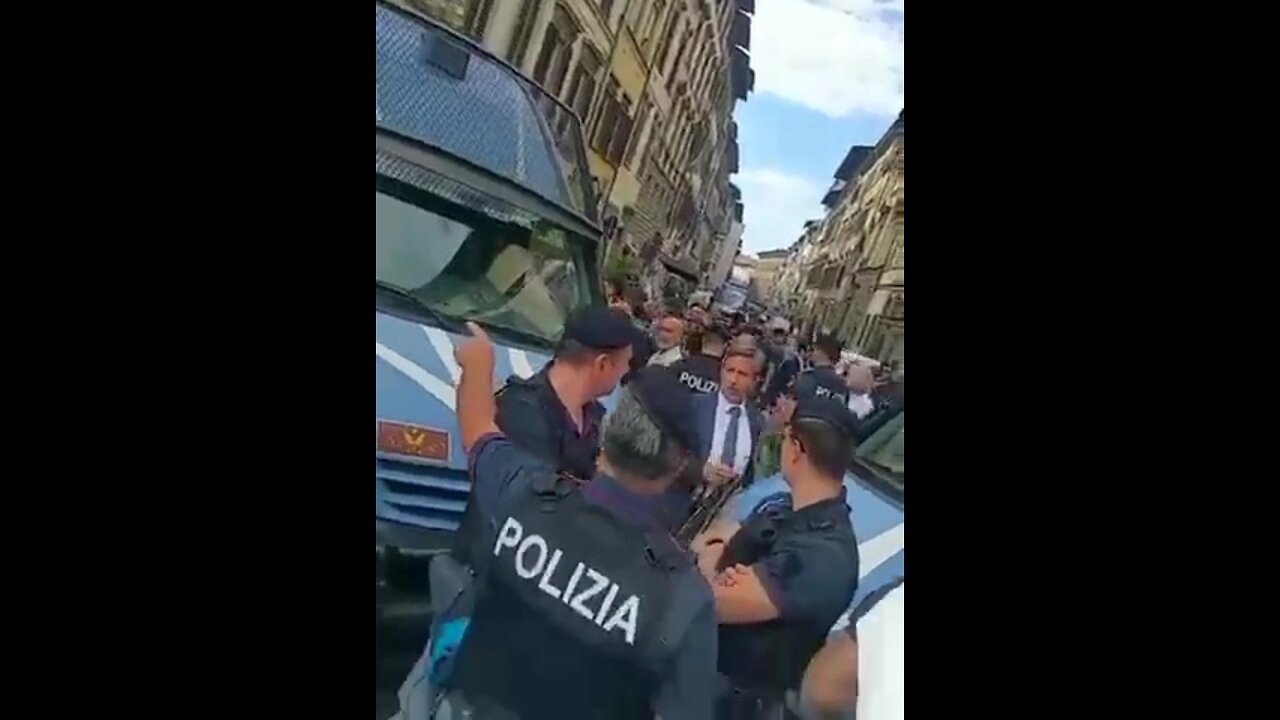 Italy - People surround the police and call them murderers.