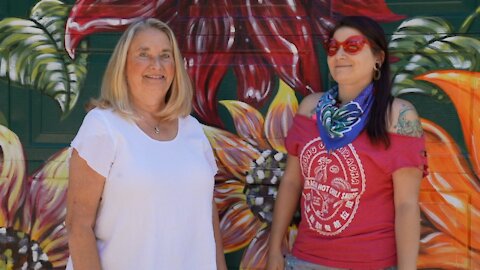 Deidre Garlock is one of Gelardi's clients. Her garage door is covered in bright multicolored sunflowers.