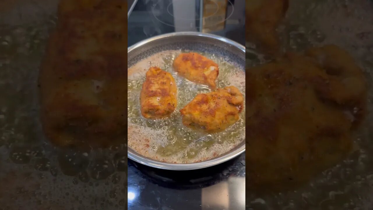 Shallow frying veal cordon bleu in olive oil