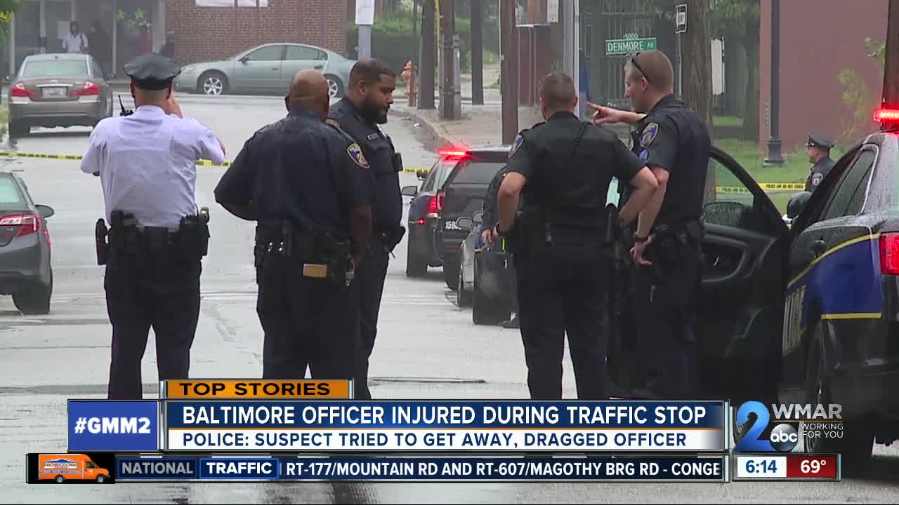 Baltimore officer injured after being dragged by car