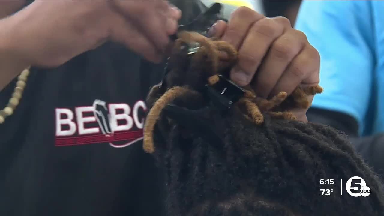 Smiles and styles: Barber college gives hundreds of free haircuts to Akron kids