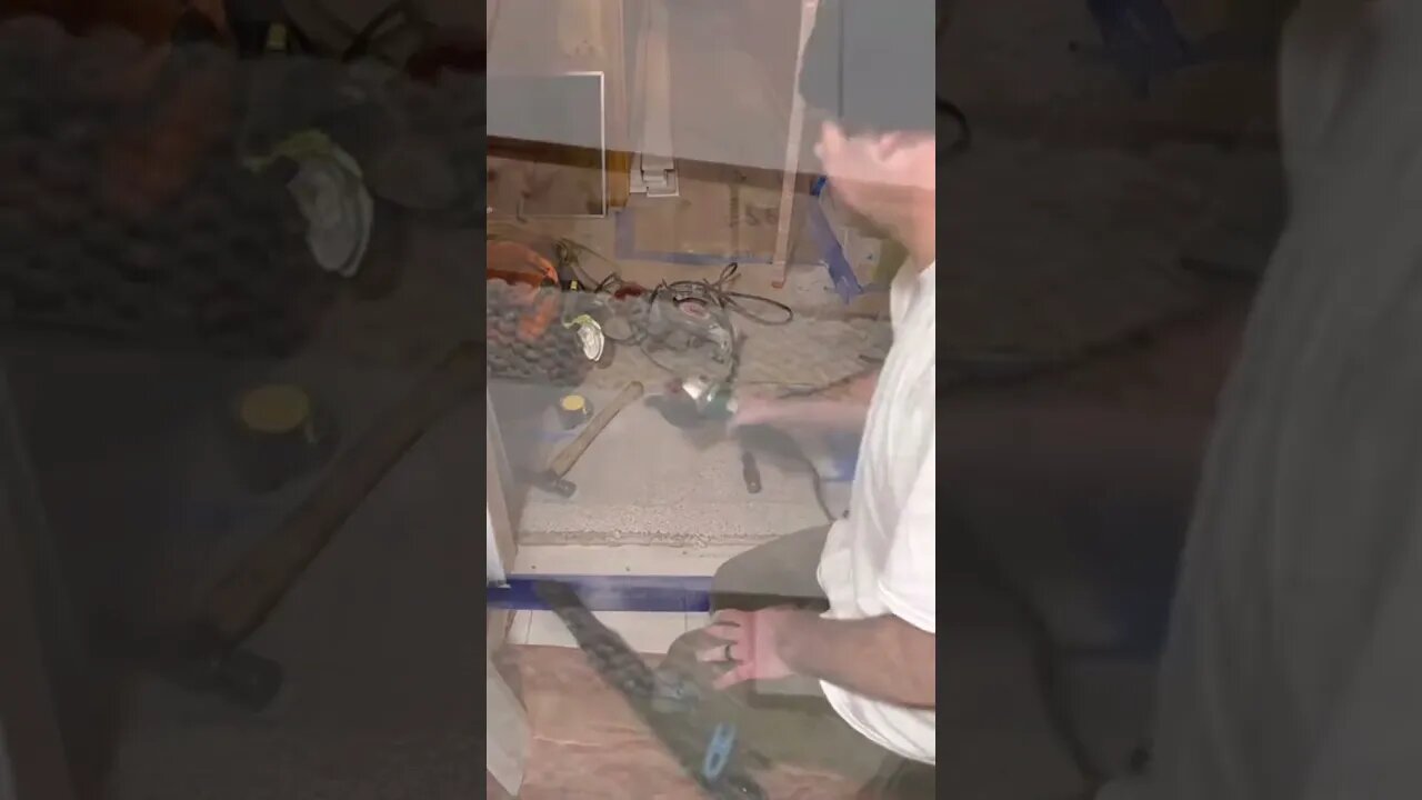 Angle grinder on floor tile