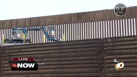 Crews heighten border fence in San Ysidro