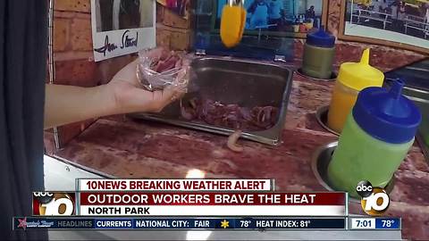 Outdoor workers brave the heat in North Park