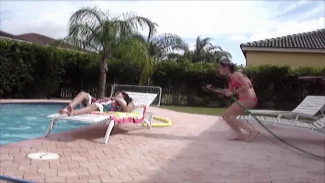 Girl Pranks Her Sister With A Hose, Ends Up Falling In The Pool