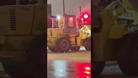 Snow Removal clearing at night