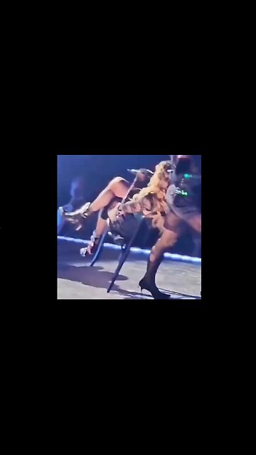 Madonna Wipes Out While Her Chair Is Being Pulled By Her Dancer