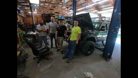 Me and my brothers hanging out and changing the engine out in a Jeep