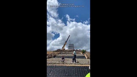 Two Russian Su-25s fly over Saur-Mogila, a memorial dedicated to the war against the German Nazis