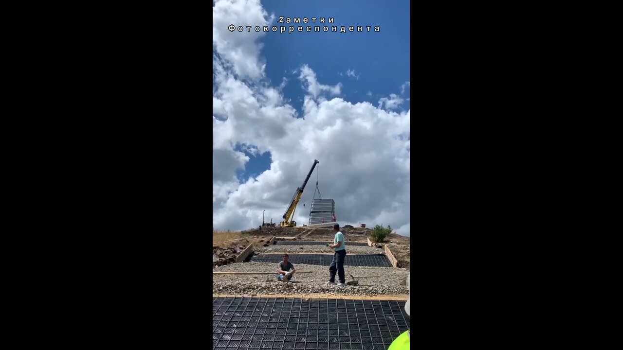 Two Russian Su-25s fly over Saur-Mogila, a memorial dedicated to the war against the German Nazis