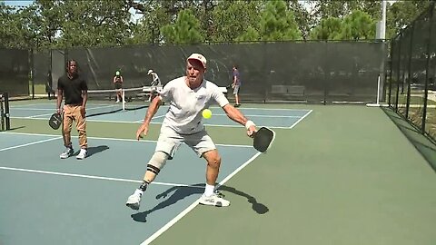 One-legged pickleball player