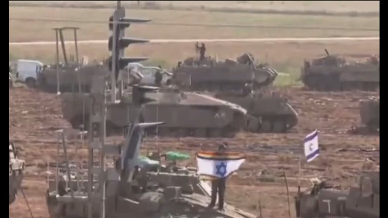 Israeli 'Defense' Force Soldier Holding A Combination Israel-Fag Flag