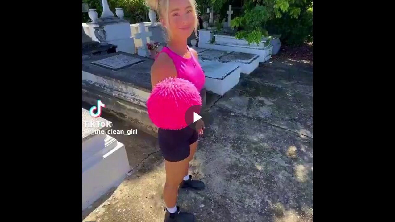 I don't see why the video is offensive. She's just cleaning gravestones and not disturbing anyone.