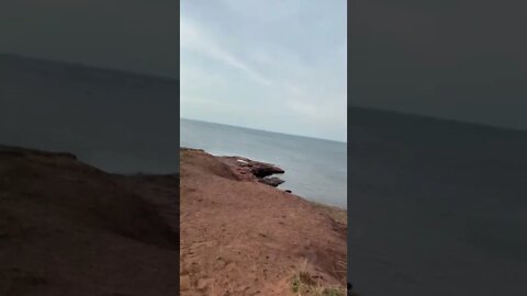Climbing around a lookout at the beach