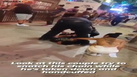 Gangsta tries to steal the golden chain of a pinned down by police gangsta