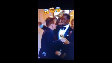 Watch the Pedo Diddler try to kiss Bono