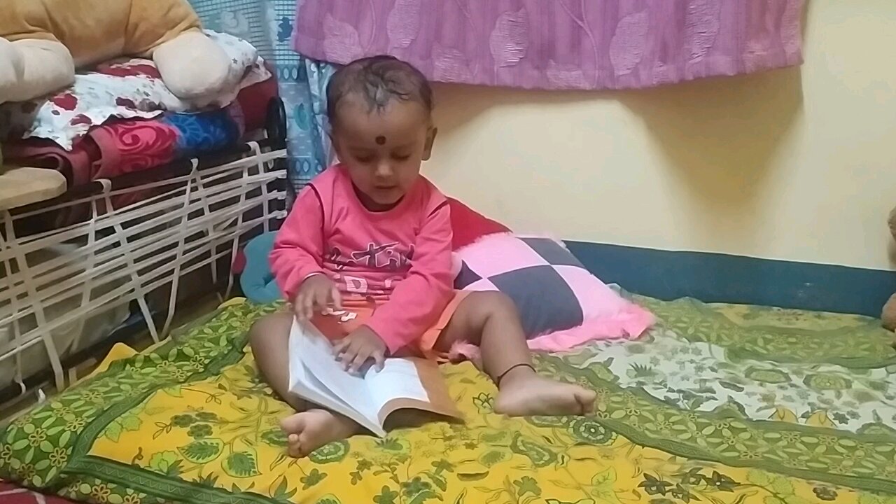 Divyaansh reading book