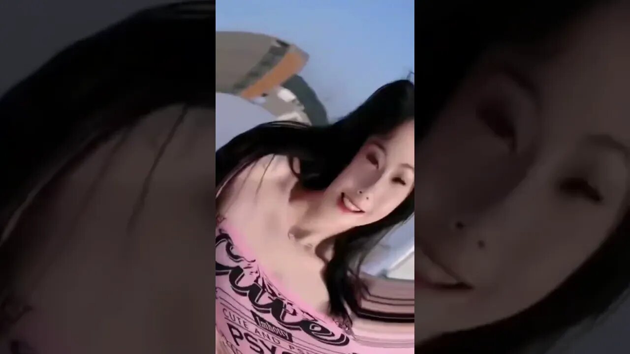 Hot Chinese Girl Is Relaxing Enjoying A Day At The Beach