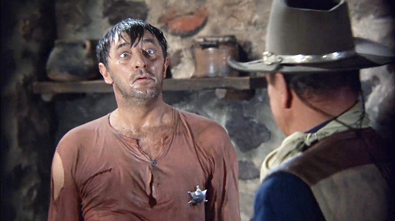 John Wayne clobbers Robert Mitchum on the head in El Dorado 1967