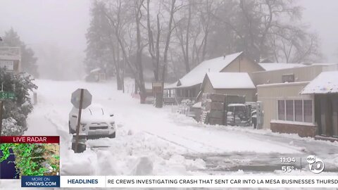 Snow piles up in Julian as some look to find their way down the mountain