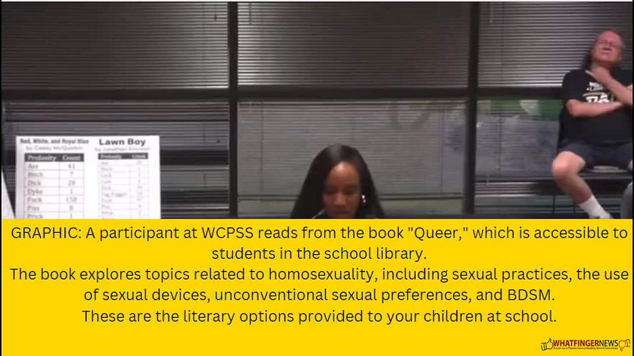 A participant at WCPSS reads from the book "Queer," which is accessible to students