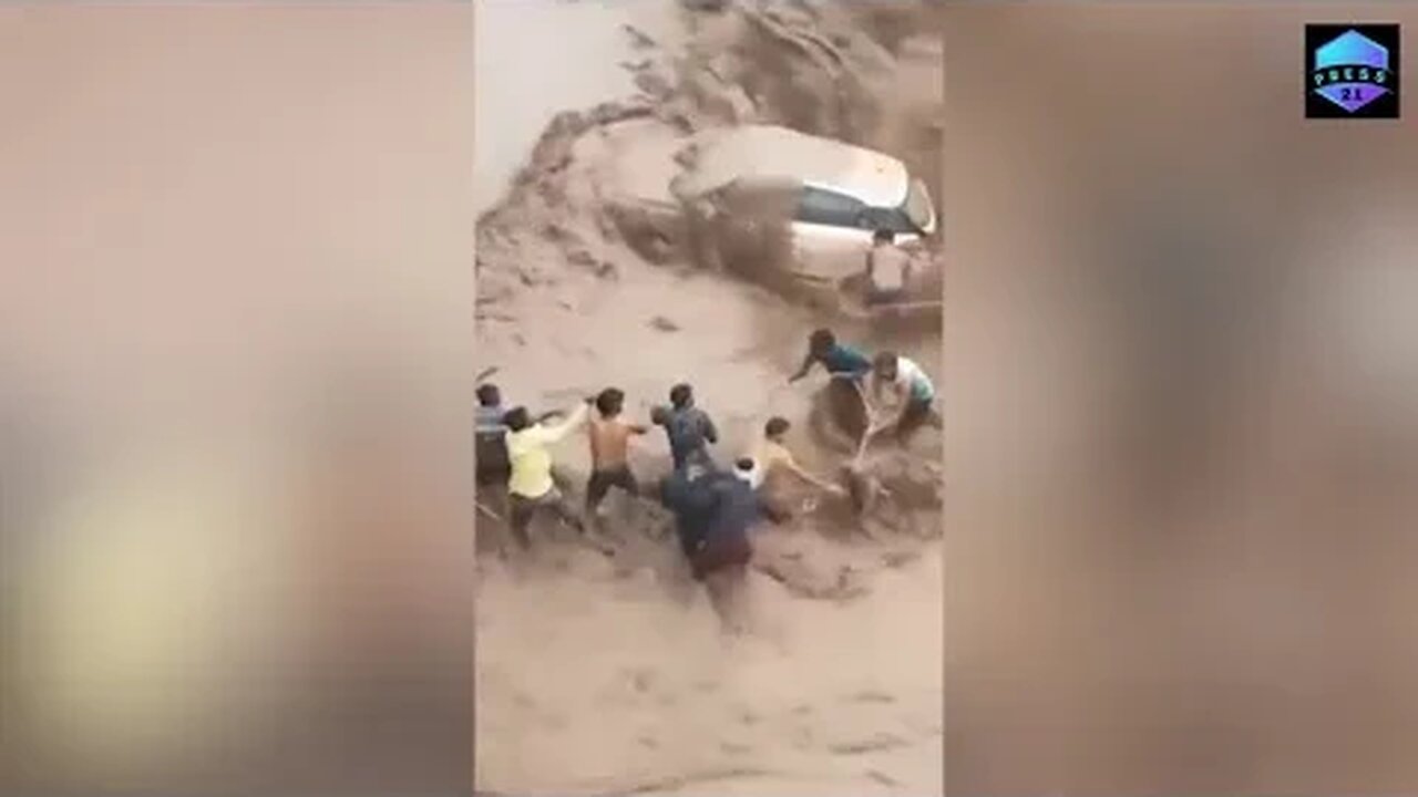 Human chain saves woman from raging floodwater