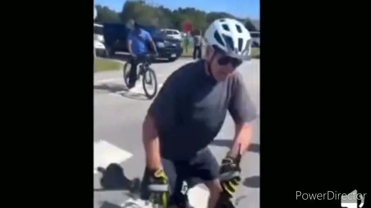 BIDEN FALLS OFF HIS BICYCLE WHILE STANDING STILL