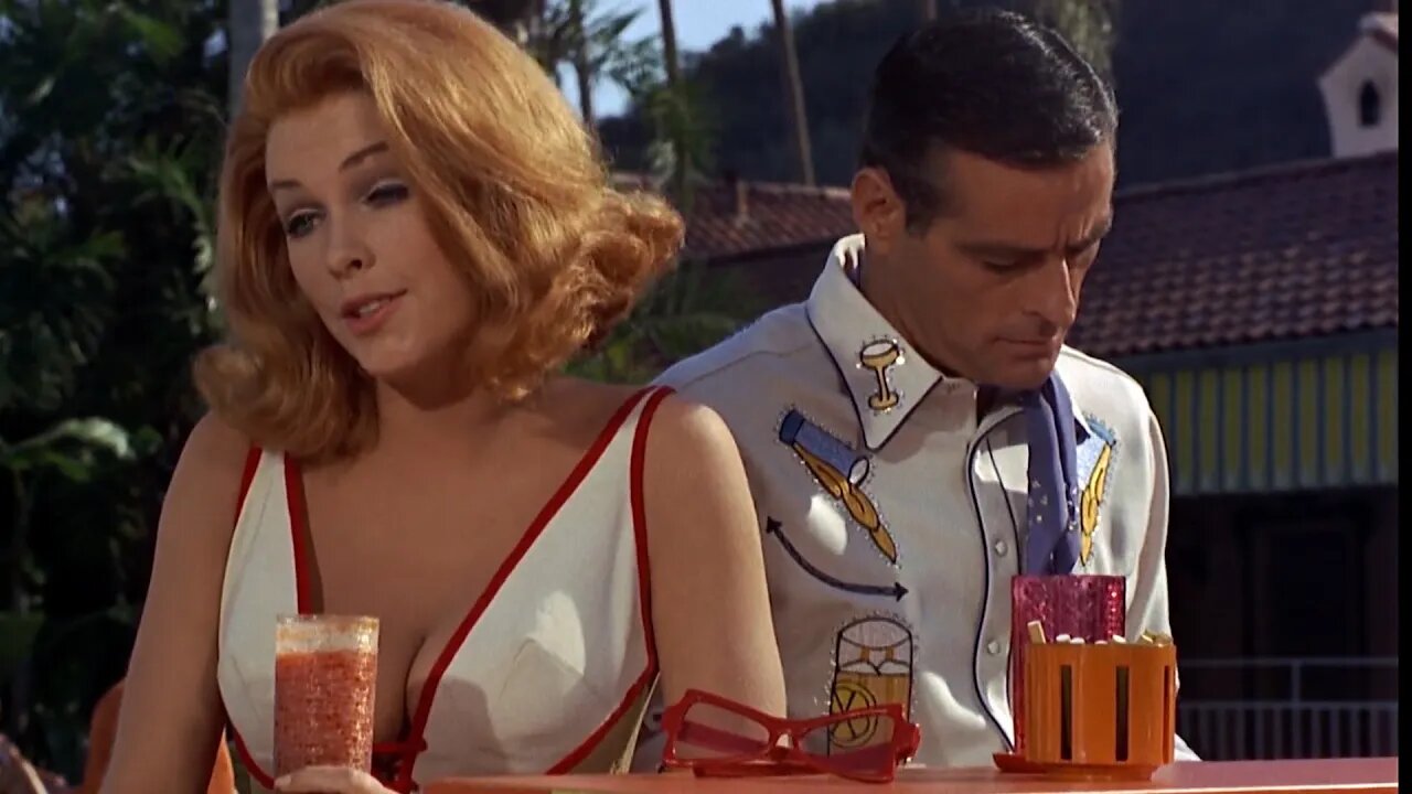 Stella Stevens spills her drink on Dean Martin in The Silencers 1966