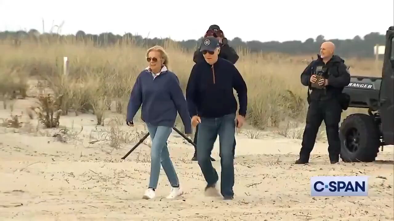 Biden has difficulty walking across the sand at his Delaware beach house.