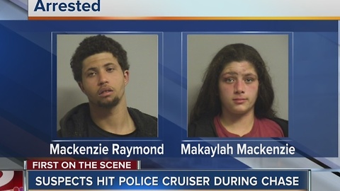 Two arrested after crashing into police car