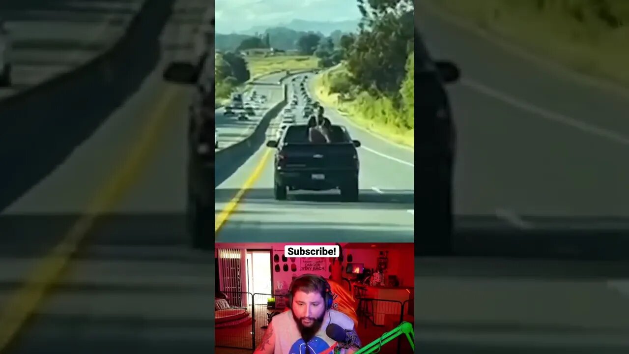 Woman climbs onto truck on highway