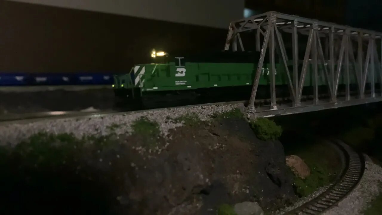 N Scale BN excursion train on the layout “Glacier loop” at night