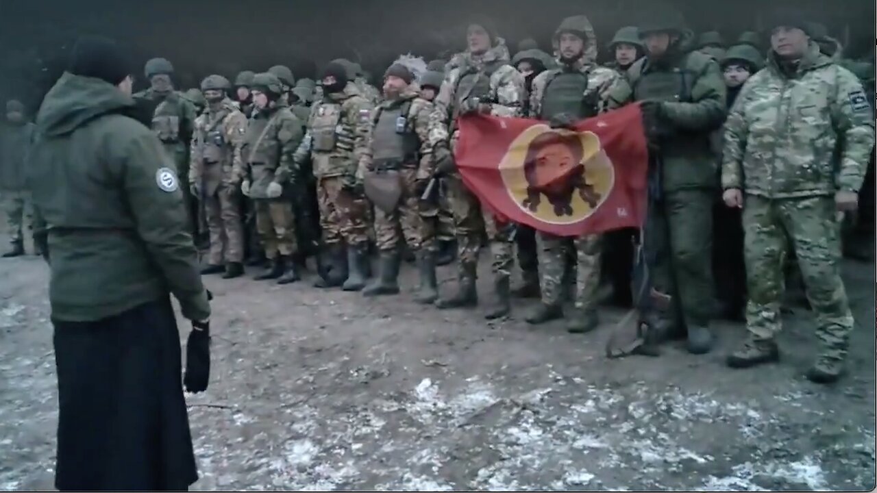 Russian soldiers pray before going on a combat mission against Black Rock financed cannon fodder