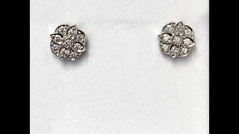 Custom moissanite floral earrings in platinum stud mountings