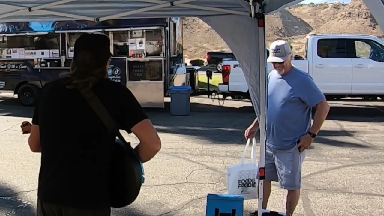 Man smiles at me while playing music at a Farmer’s market - #buskerlife #farmersmarketsinger