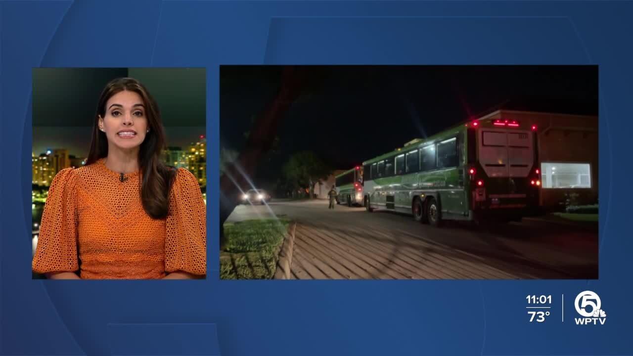 Migrants arrive in buses to be processed in Riviera Beach