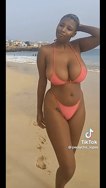 Sexy and busty black bikini beauty