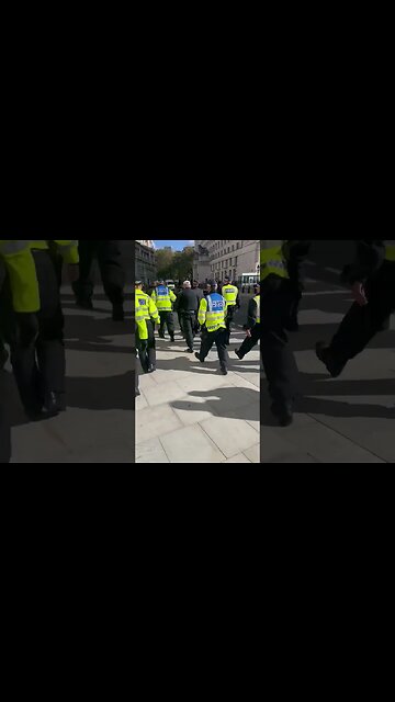 A dozen police officers just dragged away a man who unveiled his union