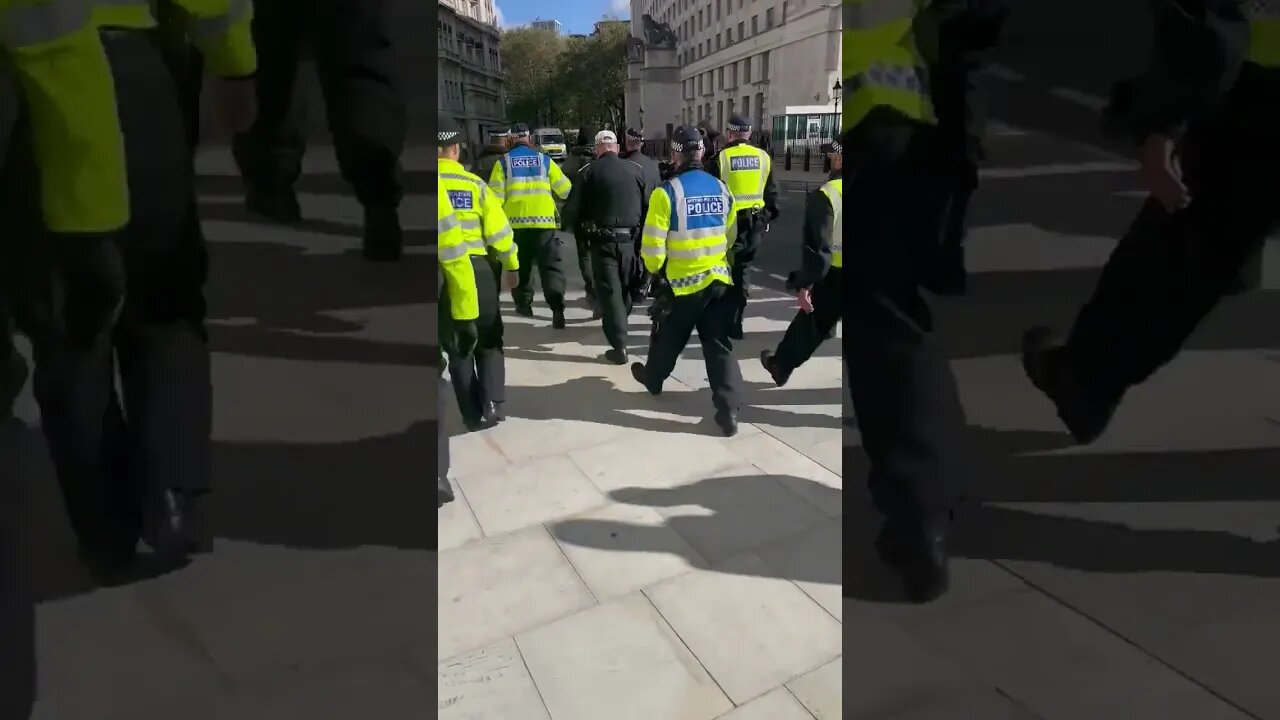 A dozen police officers just dragged away a man who unveiled his union