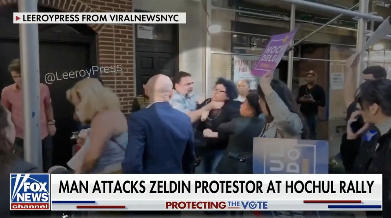 AN OUTRAGE! Hochul supporter grabs protestor by the throat 5th Nov