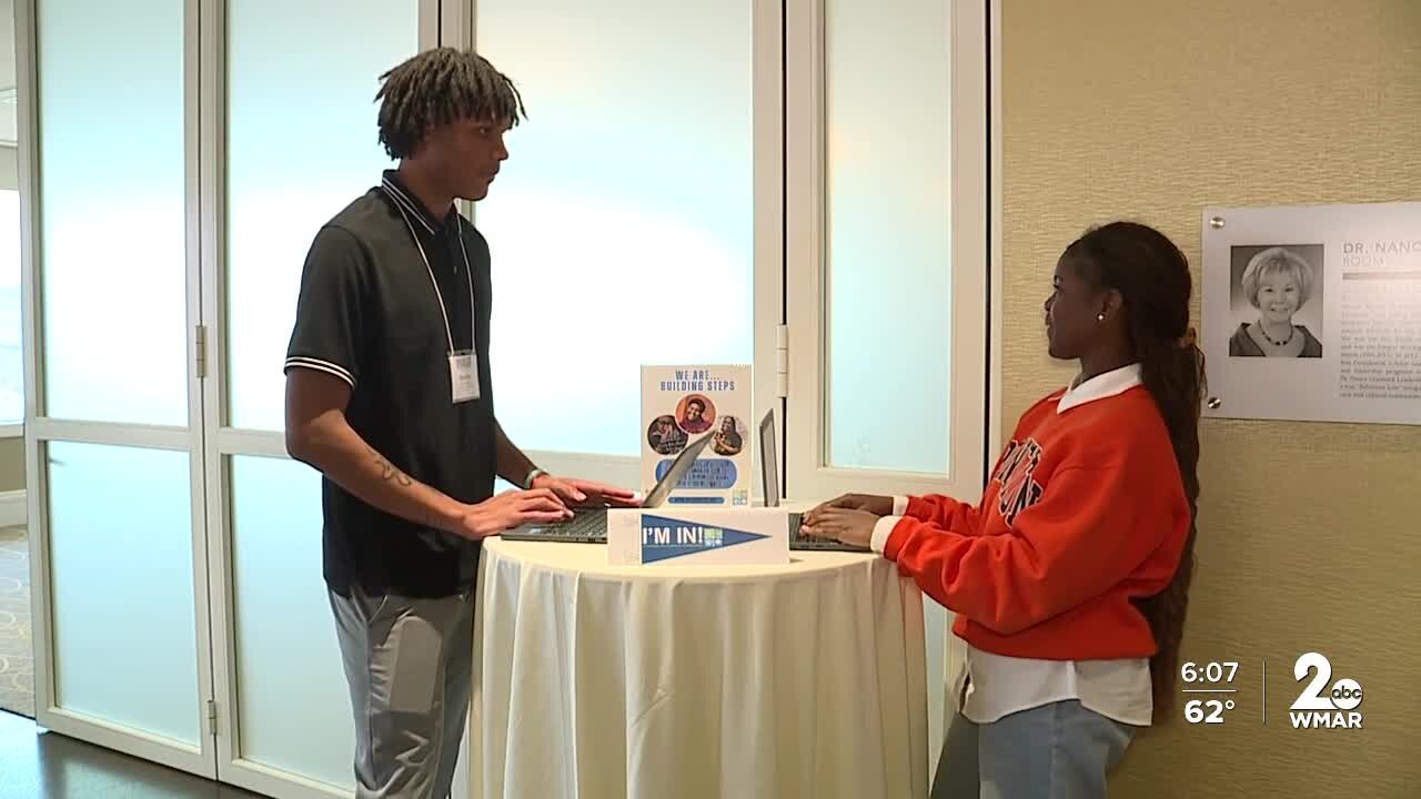 Baltimore City School students celebrating college acceptance letters