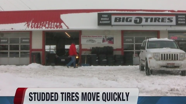 Studded tires move quickly in tire stores in snowstorm