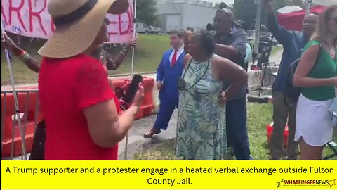 A Trump supporter and a protester engage in a heated verbal exchange outside Fulton County Jail.