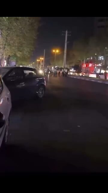 Fearless Young ⁦‪#Iranian‬⁩ protesters in the city of Amol kneel in front of violent riot police.